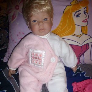 Cute face, blond hair - Realistic baby doll. 22.5 "